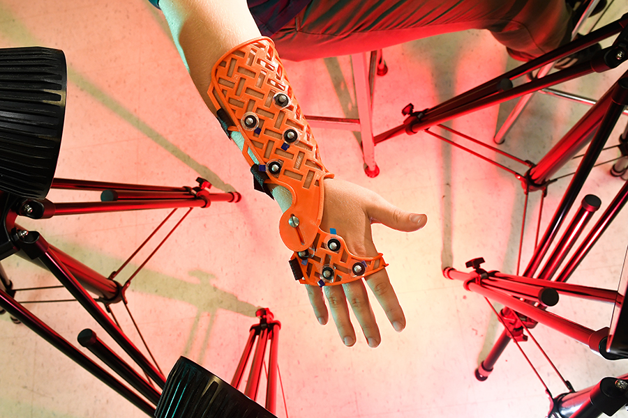 Professor Laurel Kuxhaus works with student Rachel Martin in a lab where they construct limited motion wrist braces