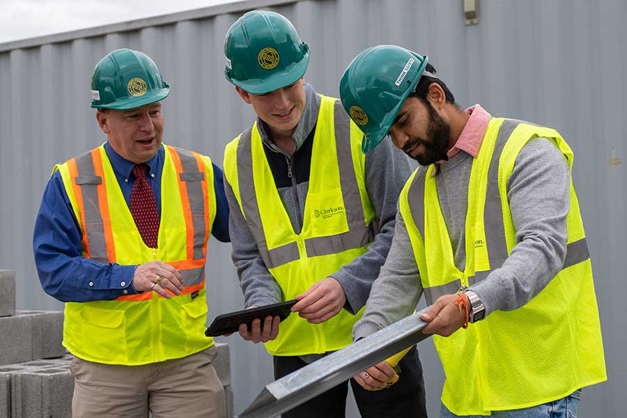 Students working with Professor Backus on a construction project