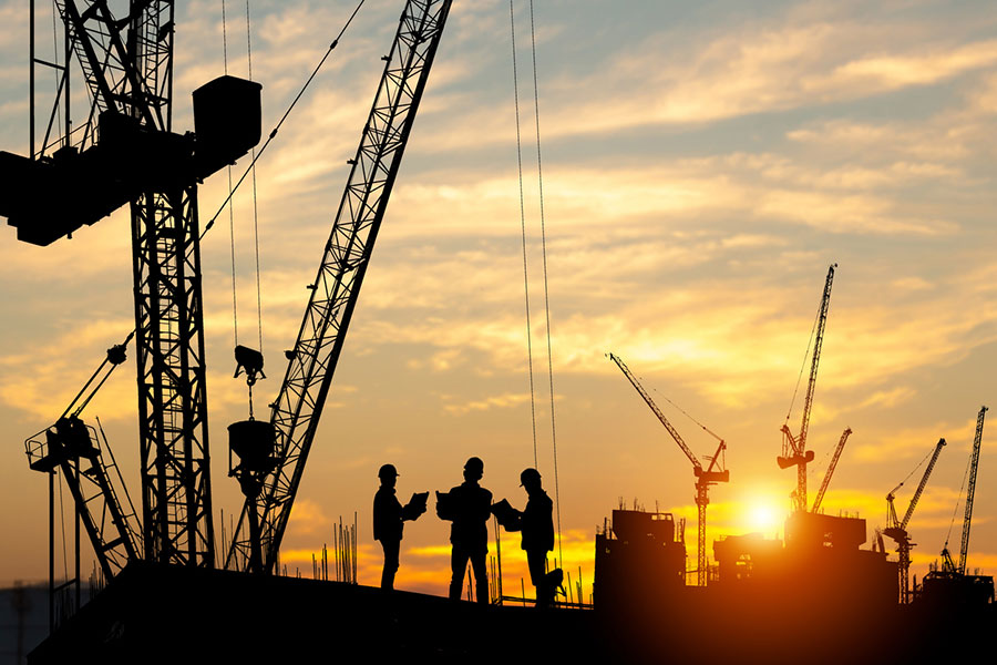Construction crew in the sunset
