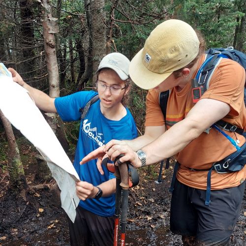 A photo of Jon Wilson muddy while on a hike.