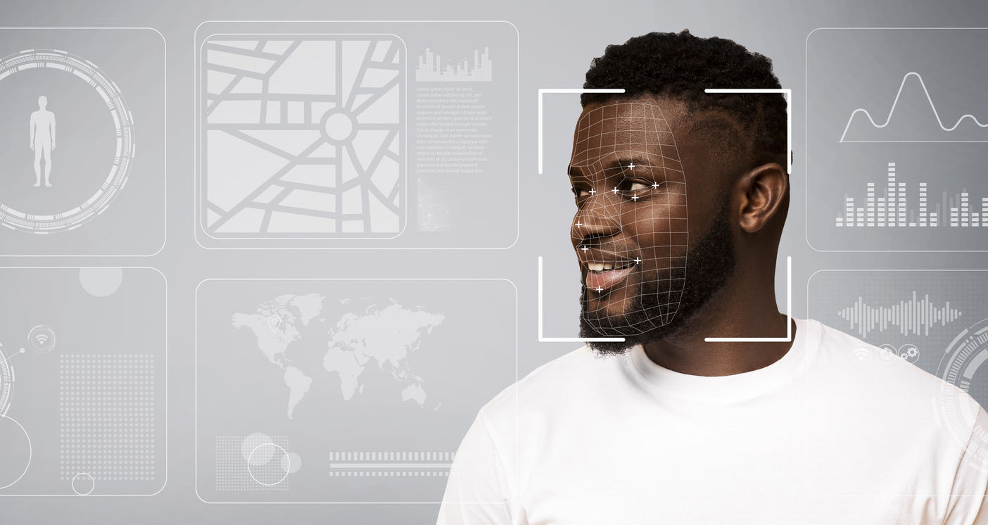 A man in a white tee is scanned for biometric data, which is displayed all around his image.