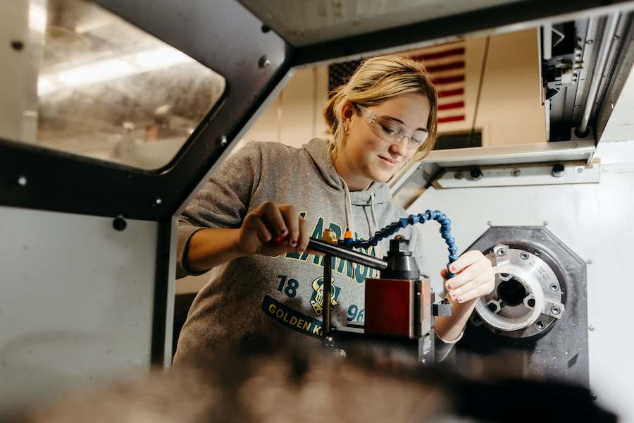 Female student with equipment.