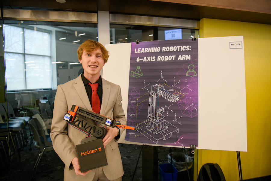 Student with robotic arm.