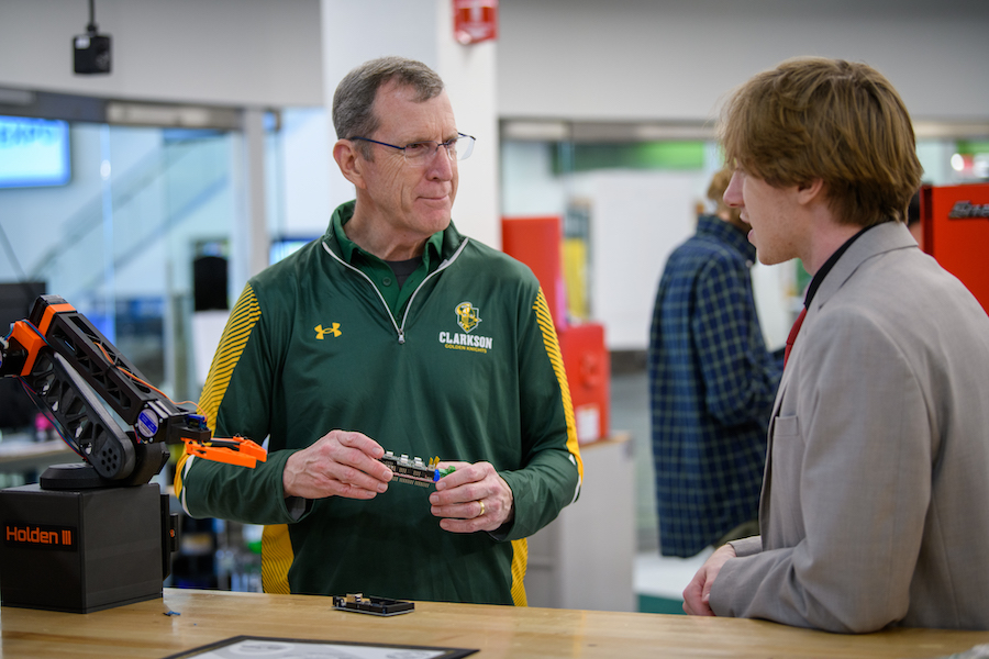 A Clarkson leader talks with a student.