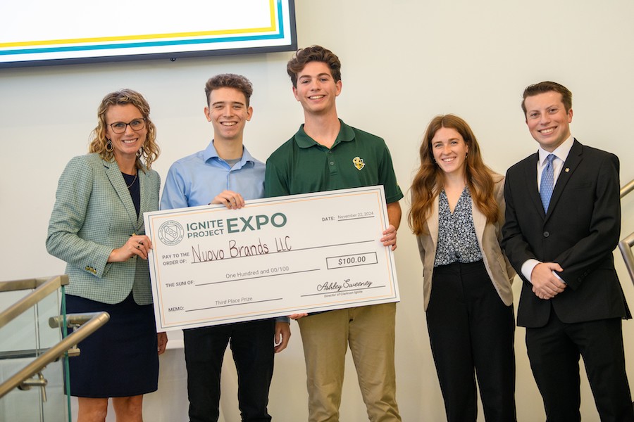 Winning group with large check.