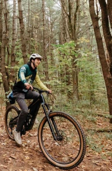 Male student on mountain bike.