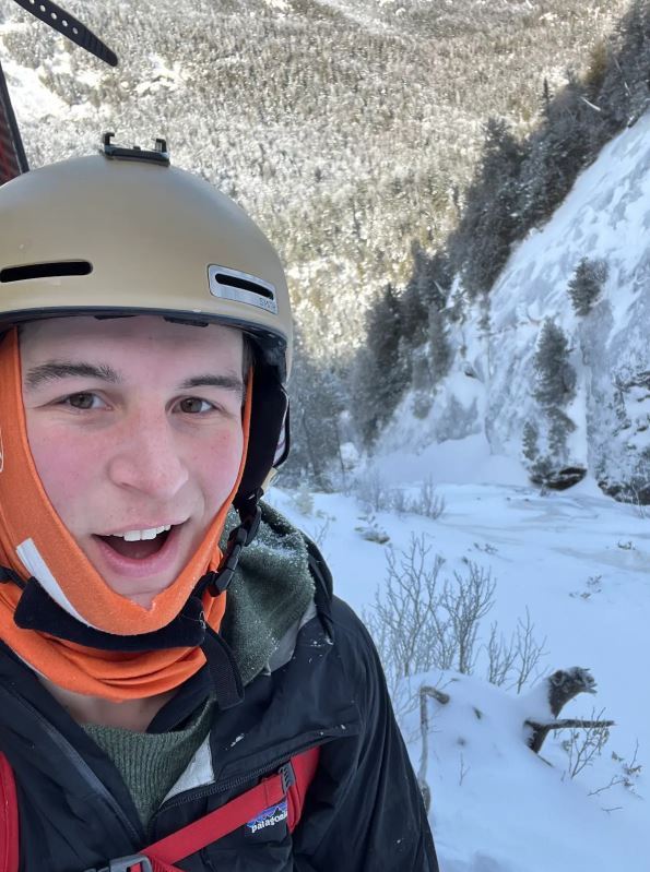 Male student hiking in winter