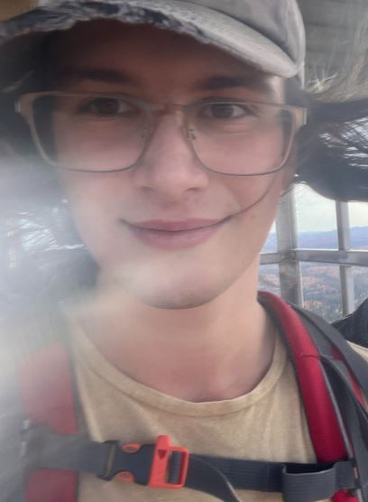 Male student in hiking gear