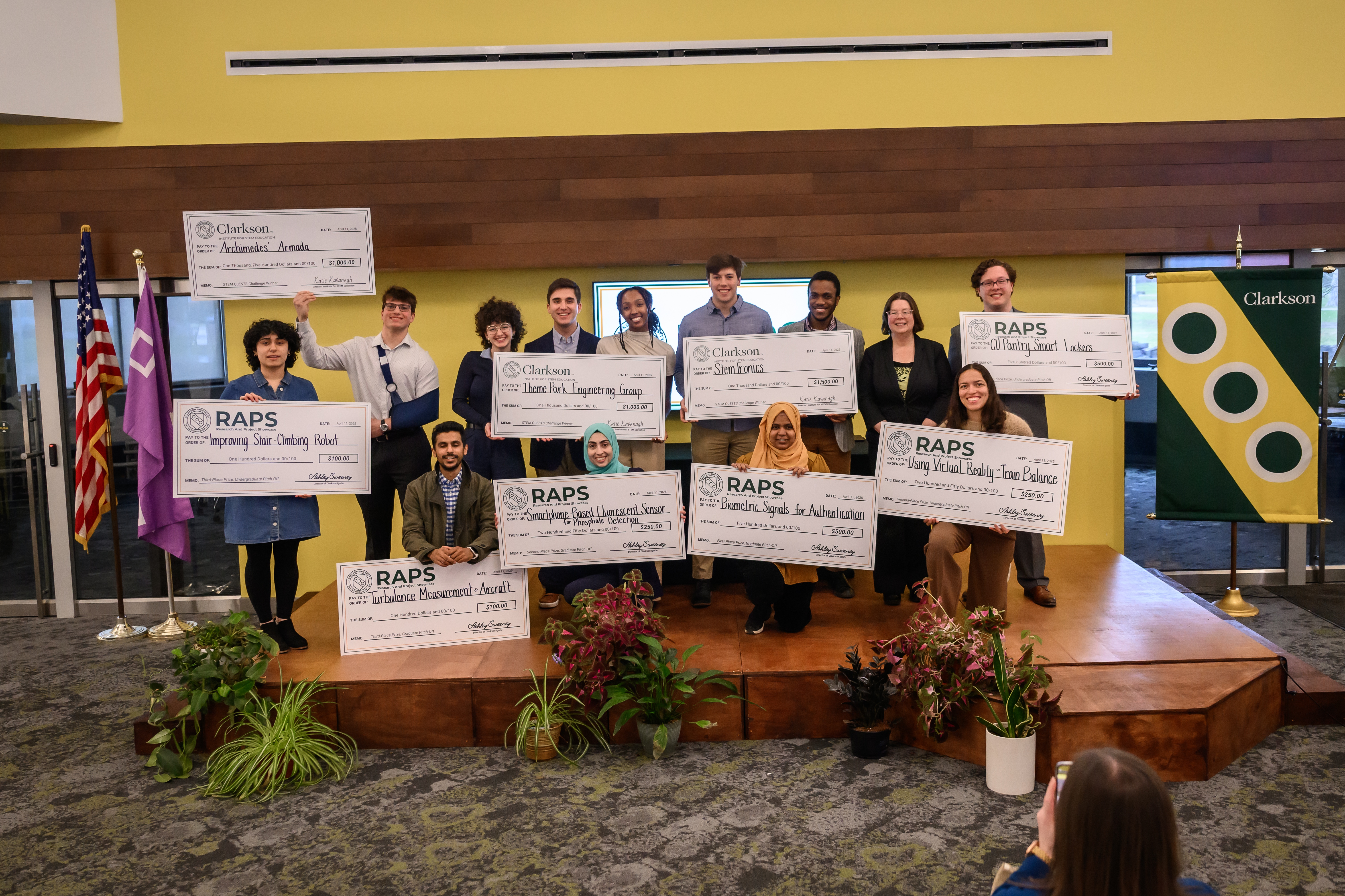 Several students recieving research prizes.