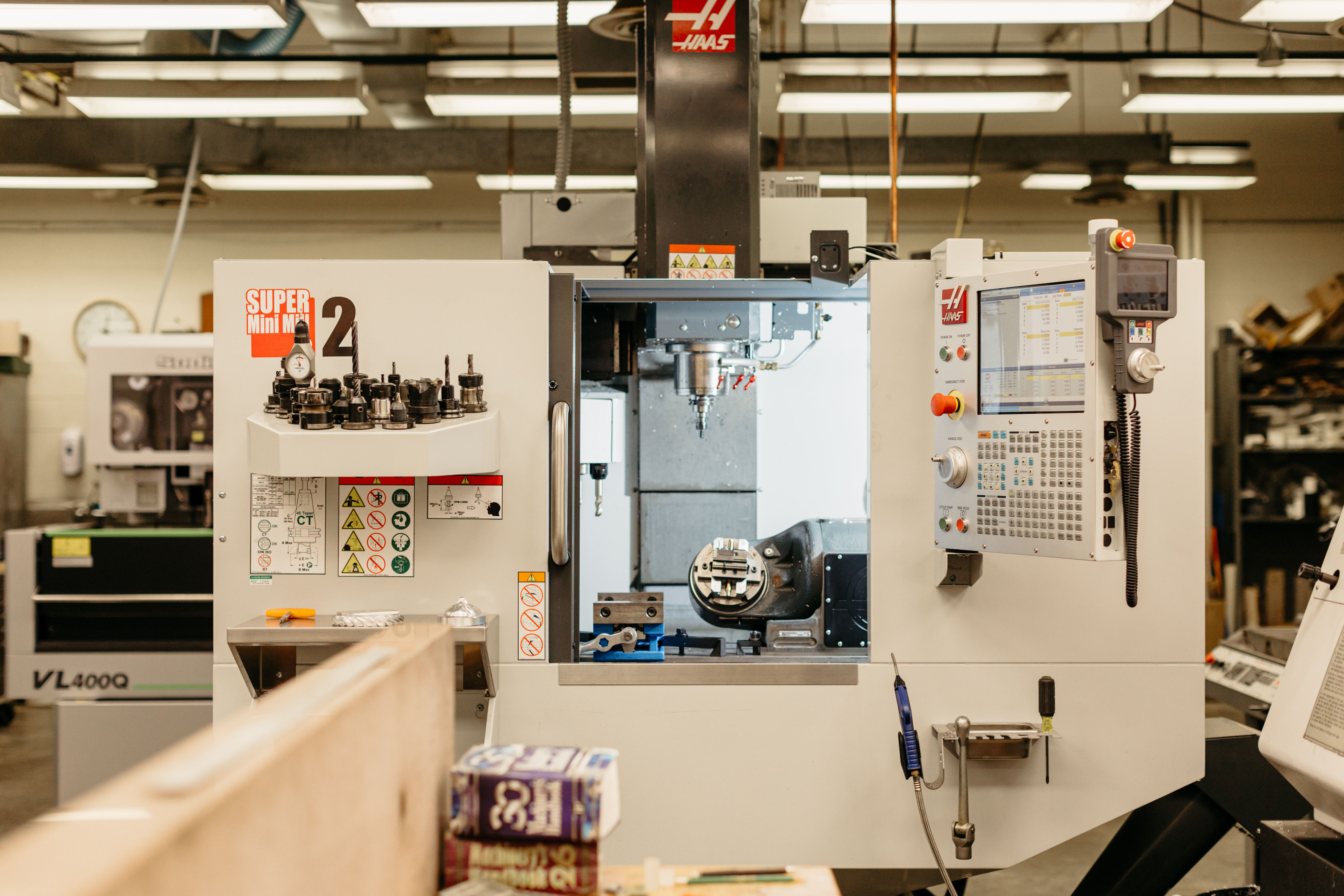 A CNC machine sits in a machine shop