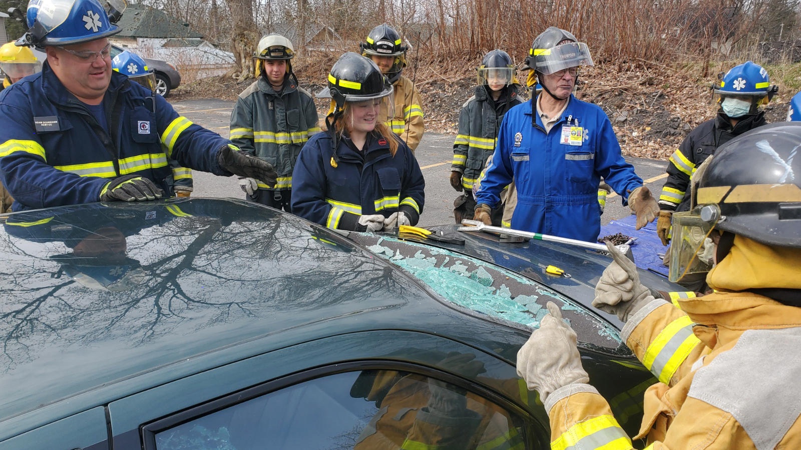 EMS Student working on breaking car windshields