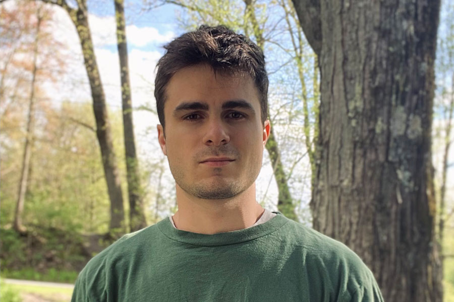 An outdoor headshot of Clarkson power engineering alum Isaac Ashdown